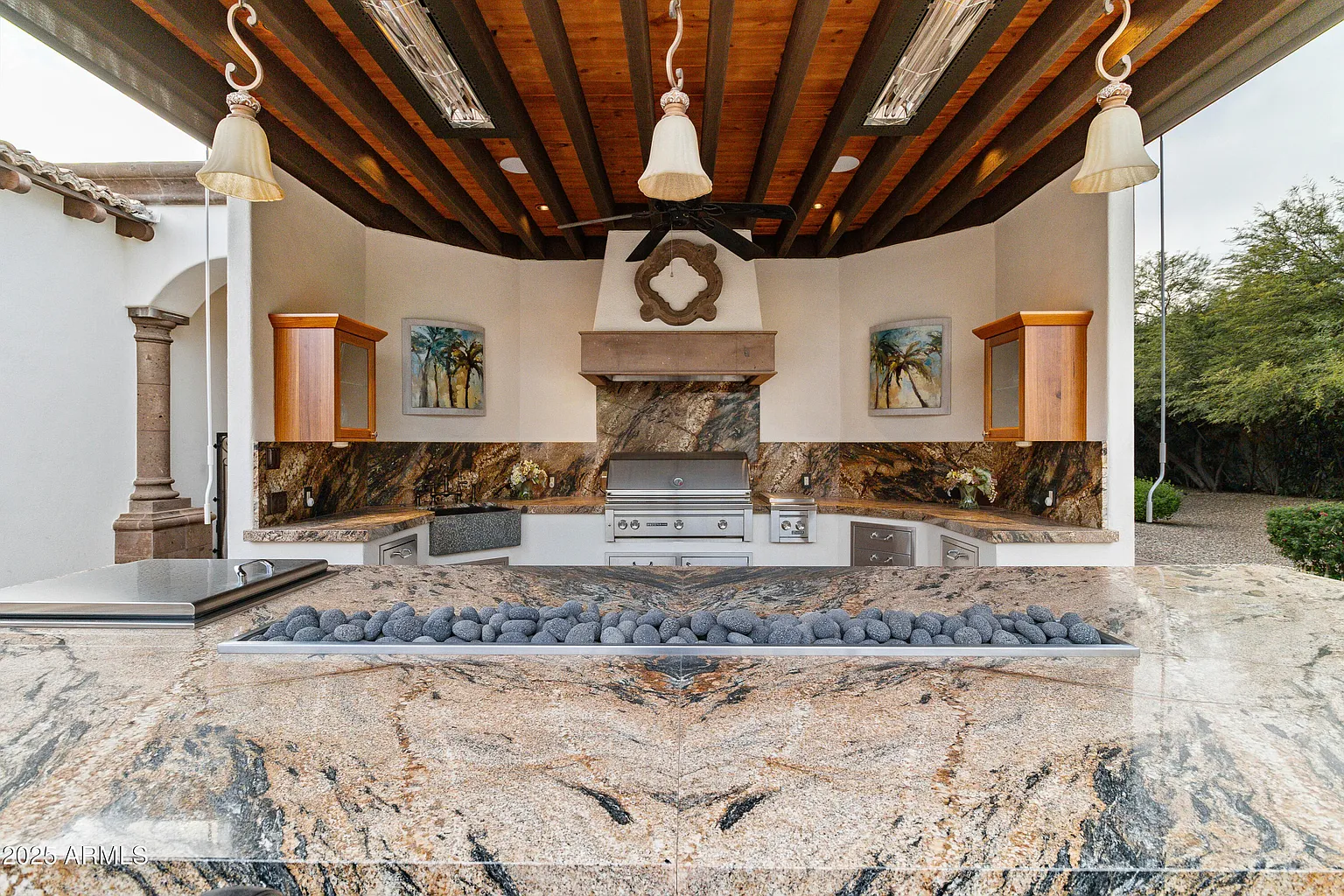Covered barbecue pavilion with stone counters