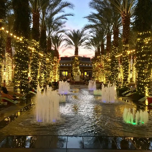 Evening courtyard with palms and fountains